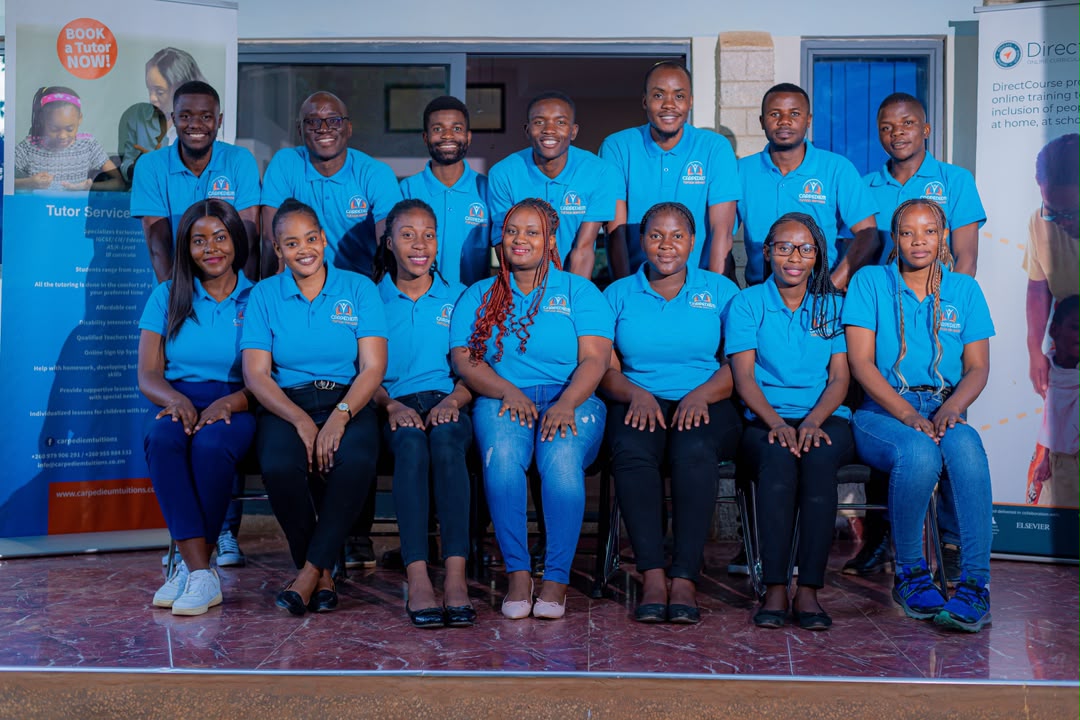 Carpe Diem tutors and staff seated together for a team photo